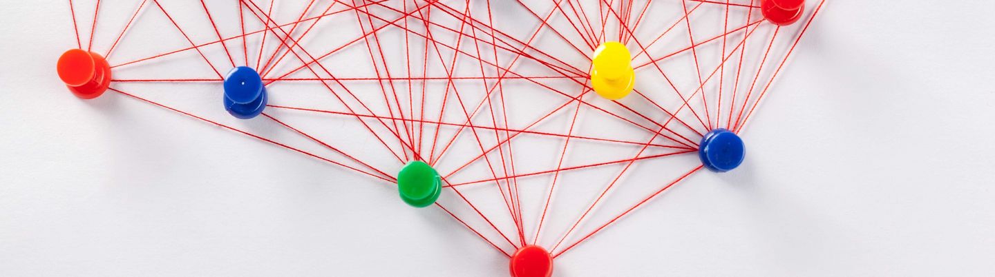 Pins connected by red thread