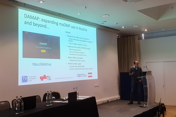 The photo shows the speaker on the right hand side and the presentation on the left.