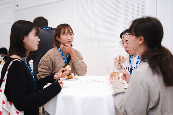 Four japanese persons at high table