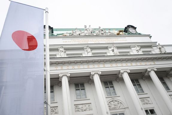 Japanese flag in front of TUW-main building. Photo taken from below.