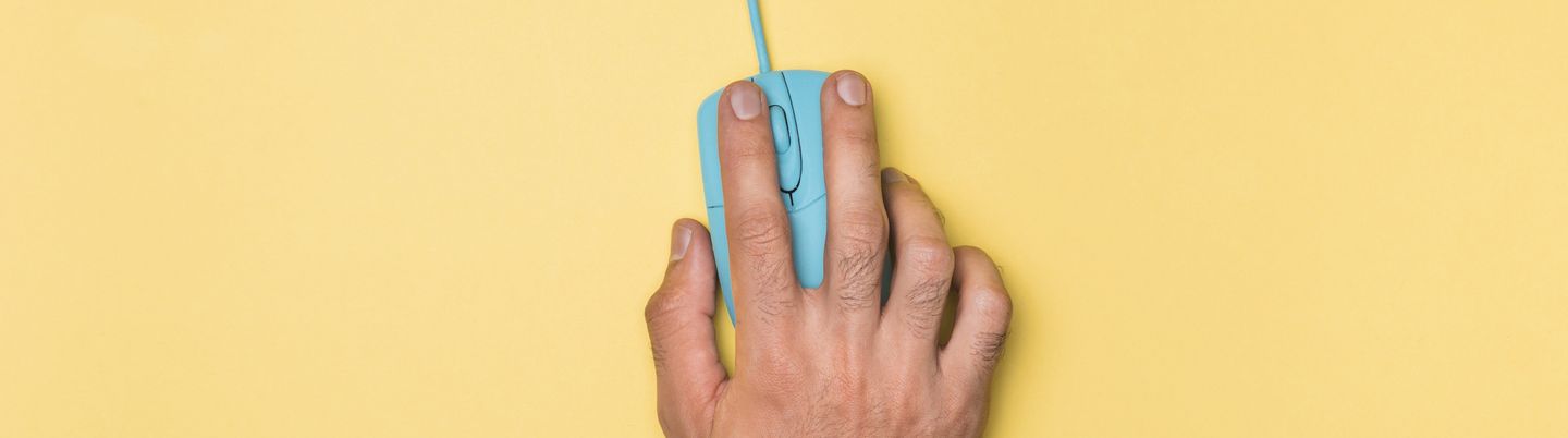 Top-shot of a hand moving a computer mouse
