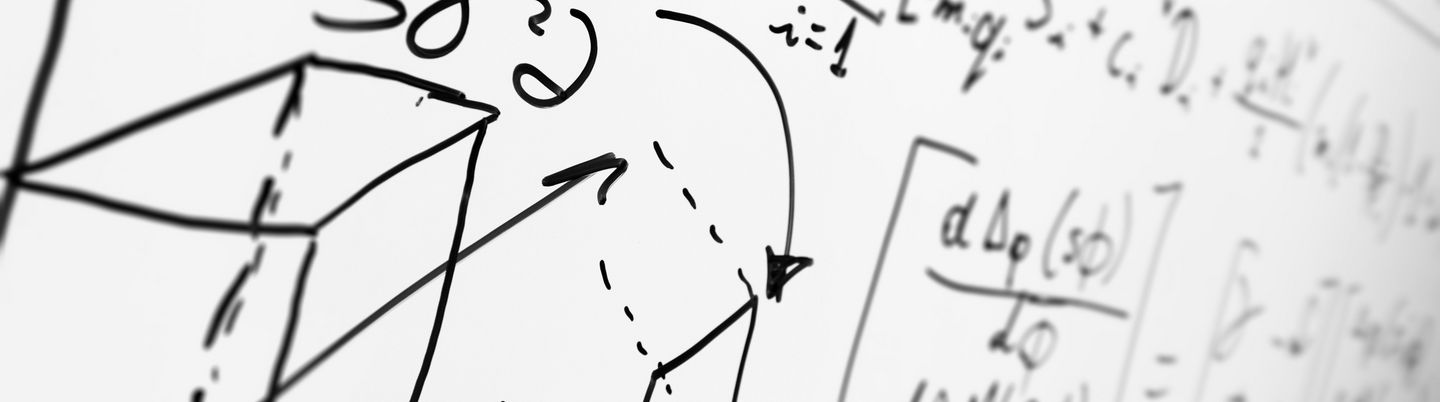 Several formulas and sketches on a whiteboard