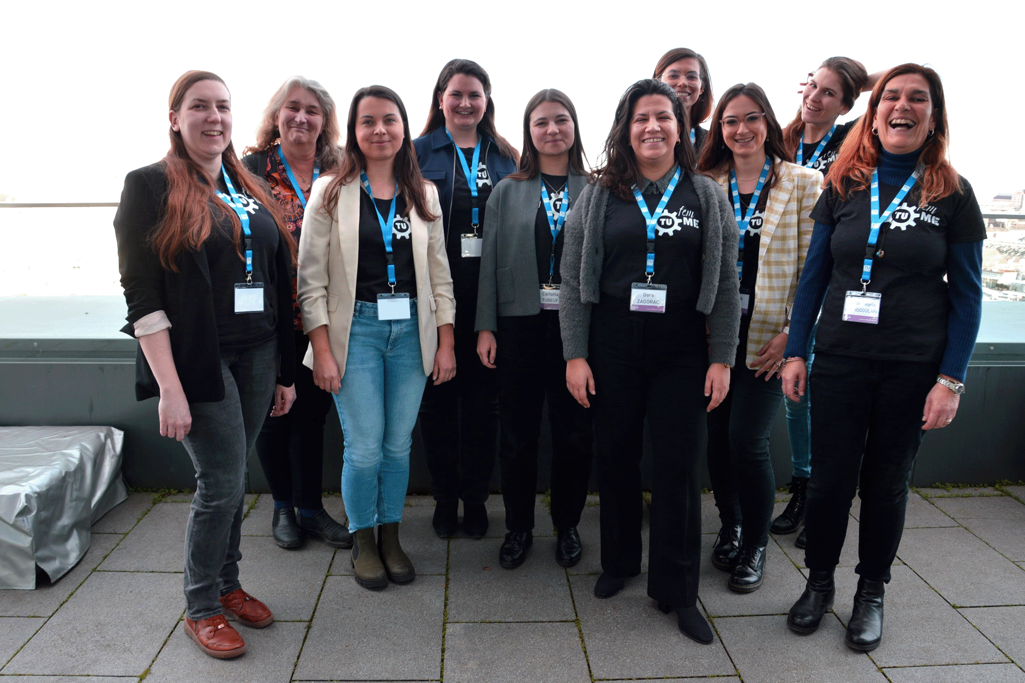Group photo with ten women on a terrace.