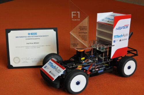 Race car with trophy and certificate