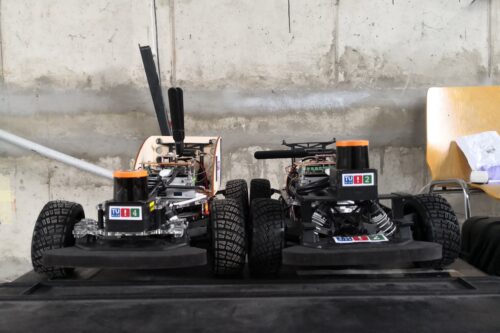 Two race cars with different LIDAR placement