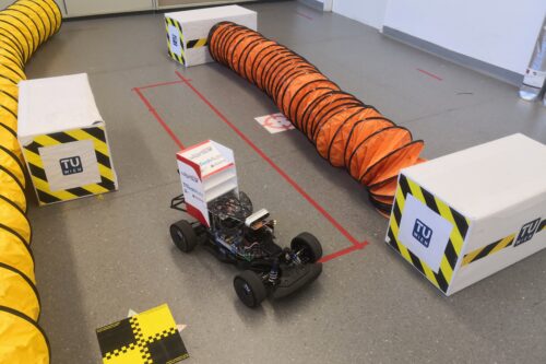 Autonomous racing car on demonstration track in lab room