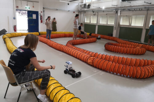 Cars racing autonomously on the race track