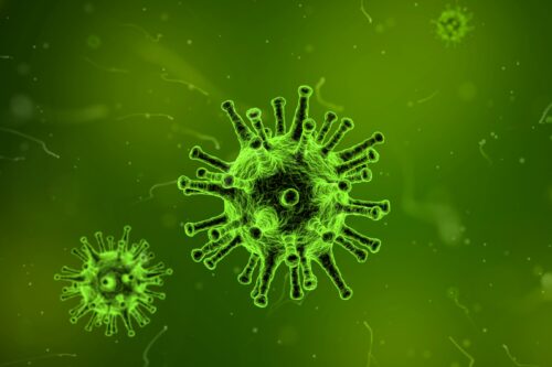 Corona-Viren auf grünem Hintergrund